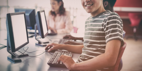 Student using computer in classrom