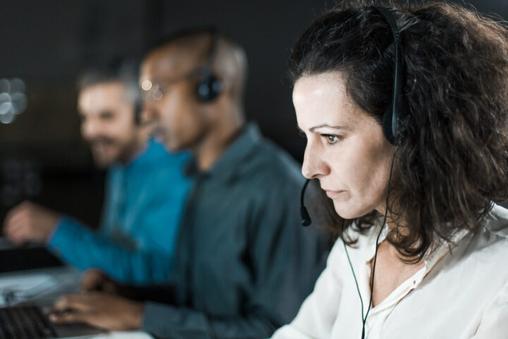 Serious looking phone operator looking at a screen